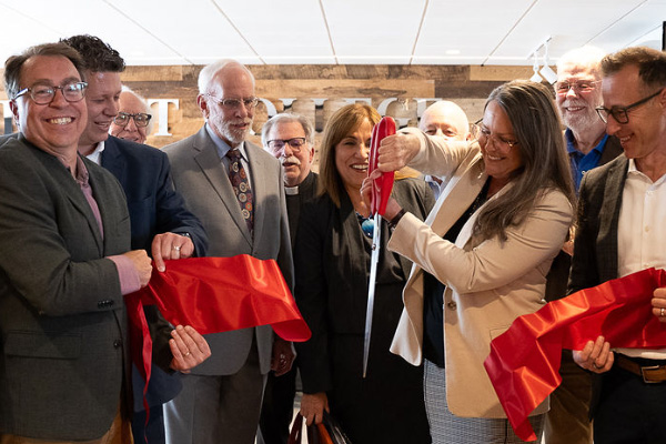 7th-floor-ribbon-cutting CCSJ attendees are shown cutting the ribbon at the ceremony
