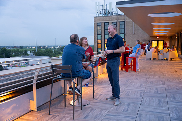 fireworks-watch-party CCSJ President Ron Tully speaking with guests at the Fireworks Watch Party