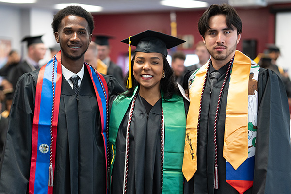 International Students pose for a photo at graduation
